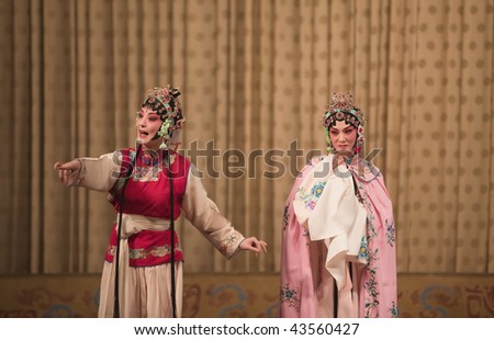 Two Beijing opera actresses are acting on the stage