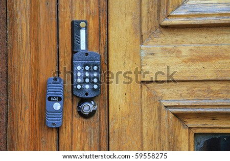 The electronic access on the old wooden door