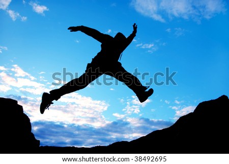 jumping man on a blue sky background