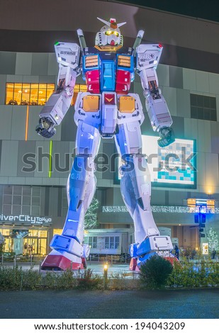 TOKYO - APRIL 14: Night view of RX-78 Gundam on April 14, 2014 in Tokyo, Japan. This life-sized Gundam is center of attraction of DiverCity located in Odaiba.