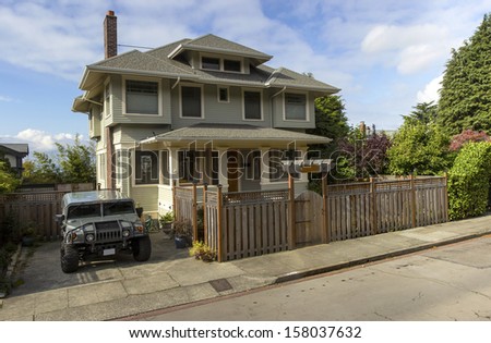 Panorama of a sport utility vehicle and a house in Seattle WA.