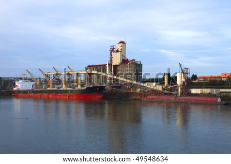Grain elevator & cargo ship.