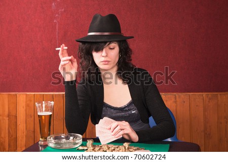 young girl playing poker, smoking and drinking beer