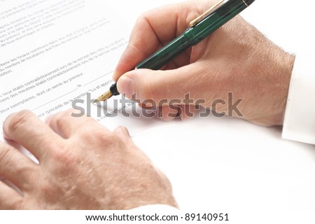 Contract signing hand and pen