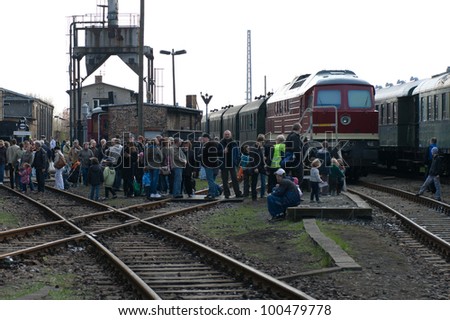 BERLIN - APRIL 14: Guests and visitors, the locomotive, DR Class 230 family (Nicknamed Ludmilla), Spring Festival, the exhibition in the Rail yard Schoeneweide, April 14, 2012 in Berlin, Germany