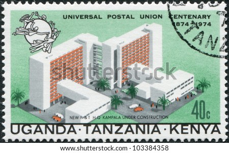 EAST AFRICAN COMMUNITY - CIRCA 1974: A stamp printed in East African Community, dedicated to the 100th anniversary of the UPU, shows a model of the central post office in Kampala, circa 1974