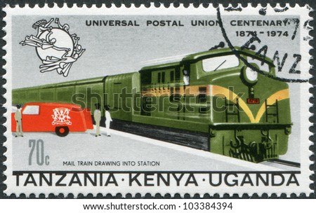 EAST AFRICAN COMMUNITY - CIRCA 1974: A stamp printed in East African Community, is dedicated to the 100th anniversary of the Universal Postal Union, shows a mail train and postal car, circa 1974