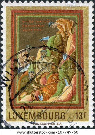 LUXEMBOURG - CIRCA 1971: A stamp printed in Luxembourg, shows Workers searching for graves of the saints. Miniatures Painted at Echternach, about 1040, circa 1971