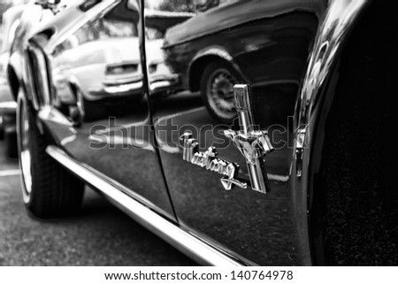 BERLIN MAY 11 Detail of the car Ford Mustang convertible first generation black and white 26th Oldtimer-Tage Berlin-Brandenburg May 11 2013 Berlin Germany BERLIN MAY 11 Detail of the car Ford Mustang convertible first generation black and white 26th Oldtimer-Tage Berlin-Brandenburg May 11 2013 Berlin Germany