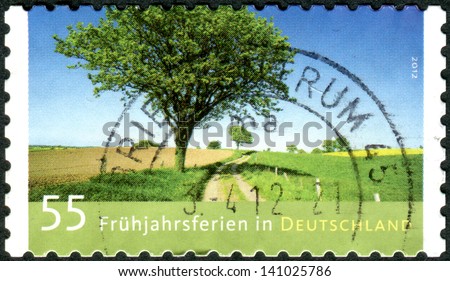 GERMANY - CIRCA 2012: Postage stamps printed in Germany, dedicated to spring break, is a landscape by Andreas Kitting, circa 2012