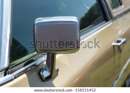 PAAREN IM GLIEN, GERMANY - MAY 19: Rear-view mirror full-size luxury car Cadillac Coupe de Ville (1960), \
