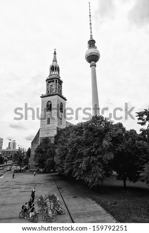 BERLIN - AUGUST 31: St. Mary\'s Church (Marienkirche) and the Berlin TV Tower (black and white), August 31, 2012 in Berlin, Germany
