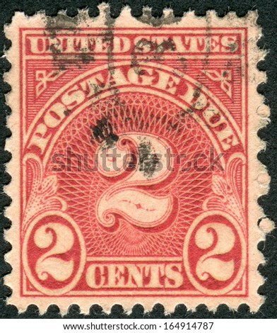 USA - CIRCA 1930: A postage stamp printed in USA, shows figure 2, the price value, circa 1930