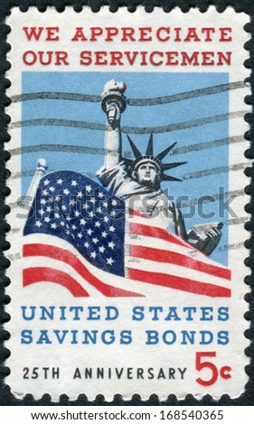 USA - CIRCA 1966: Postage stamp printed in USA, dedicated to the 25th anniversary of US Savings Bonds, and to honor American servicemen, shows Statue of Liberty & \