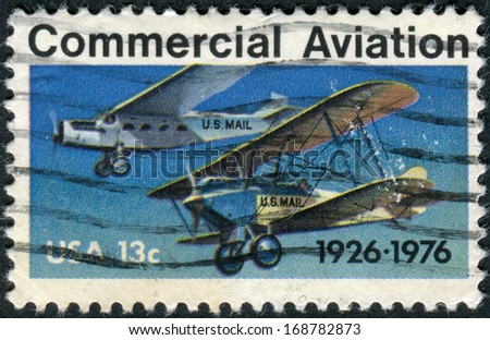 USA - CIRCA 1976: Postage stamp printed in USA, dedicated to the 50th Anniversary of 1st contract airmail flights, shows Ford-Pullman Monoplane and Laird Swallow Biplane, circa 1976
