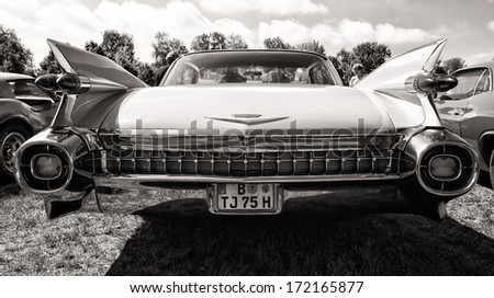 PAAREN IM GLIEN, GERMANY - MAY 19: Full-size luxury car Cadillac Sixty Special Fleetwood, rear view, black and white, The oldtimer show in MAFZ, May 19, 2013 in Paaren im Glien, Germany