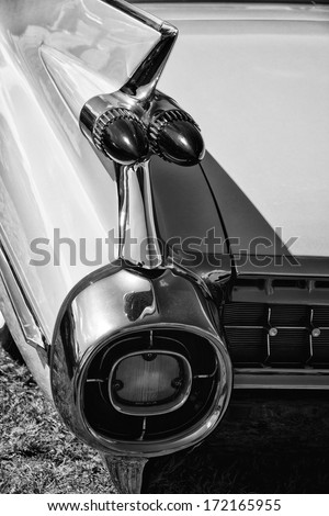 PAAREN IM GLIEN, GERMANY - MAY 19: The rear brake lights Full-size luxury car Cadillac Sixty Special Fleetwood, black and white, The oldtimer show in MAFZ, May 19, 2013 in Paaren im Glien, Germany