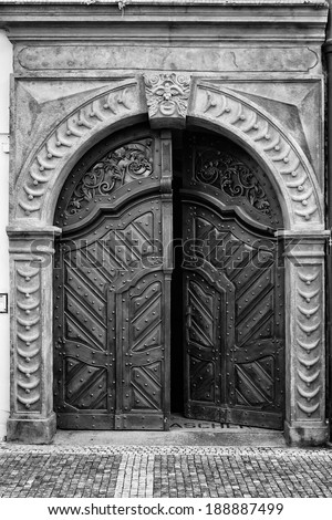 Vintage entrance gate. Black and white. Styling for the film. Large grains.