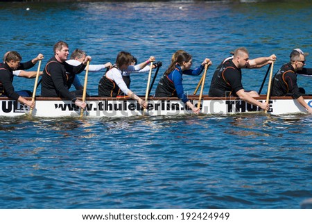 BERLIN, GERMANY - MAY 03, 2014: Rowers in a boat. 2nd Berlin water sports festival in Gruenau.