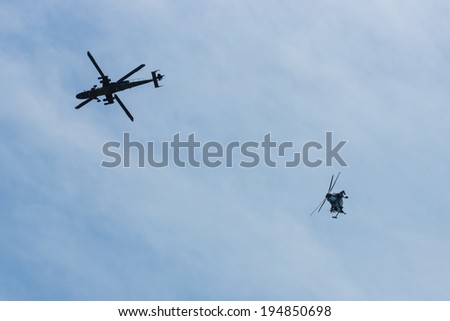 BERLIN, GERMANY - MAY 21, 2014: Demonstration flight of attack helicopter Eurocopter Tiger UHT. Exhibition ILA Berlin Air Show 2014