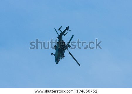 BERLIN, GERMANY - MAY 21, 2014: Demonstration flight of attack helicopter Eurocopter Tiger UHT. Exhibition ILA Berlin Air Show 2014
