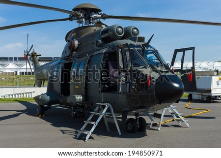 BERLIN, GERMANY - MAY 21, 2014: Multi-purpose helicopter Eurocopter AS332 Super Puma. Swiss Air Force. Exhibition ILA Berlin Air Show 2014