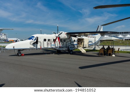 BERLIN, GERMANY - MAY 21, 2014: A twin-turboprop STOL utility aircraft, Dornier 228 New Generation. RUAG Aerospace Services GmbH. Exhibition ILA Berlin Air Show 2014