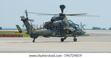 BERLIN, GERMANY - MAY 22, 2014: Preparing to fly attack helicopter Eurocopter Tiger. German Army. Exhibition ILA Berlin Air Show 2014