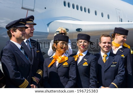 BERLIN, GERMANY - MAY 22, 2014: The crew widebody jet airliner Boeing 747-8 posing photojournalists. Lufthansa. Exhibition ILA Berlin Air Show 2014