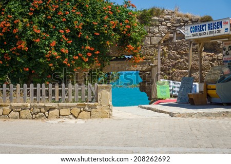 SIDE, TURKEY - JUNE 21, 2014: Passage to the sea through the ancient wall. Anatolian coast - a popular holiday destination in summer of European citizens.