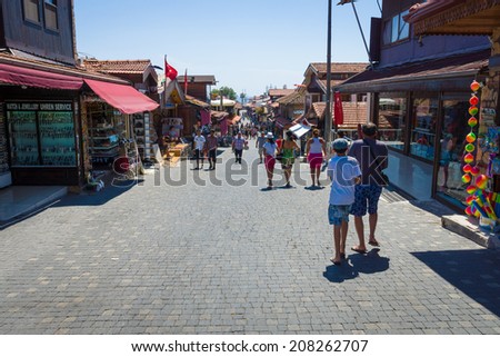 SIDE, TURKEY - JUNE 21, 2014: Shopping street in the seaside town. Anatolian coast - a popular holiday destination in summer of European citizens.