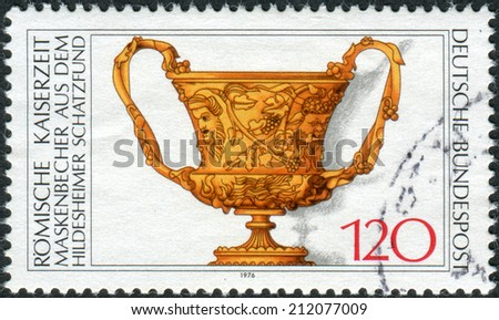 GERMANY - CIRCA 1976: Postage stamp printed in Germany, shows a Roman cup with masks, 1st century AD, circa 1976