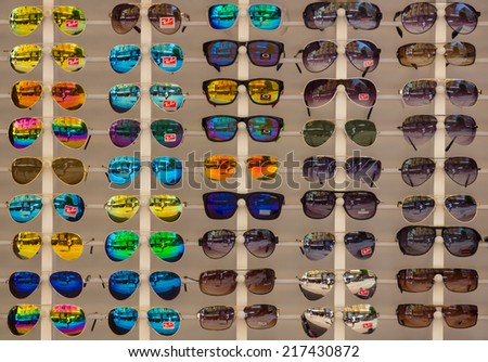 ALANYA, TURKEY - JUNE 28, 2014: Sunglasses Ray-Ban. Background. Ray-Ban is a internationally well-known brand of sunglasses and eyeglasses founded in 1937.