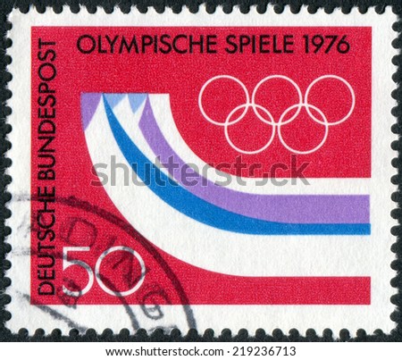 GERMANY - CIRCA 1976: Postage stamp printed in Germany, dedicated to the 12th Winter Olympic Games, Innsbruck, Austria, shows the Olympic Rings, Symbolic Mountains, circa 1976