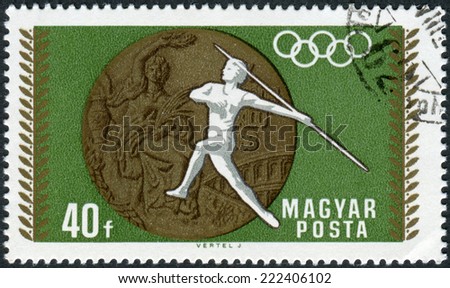 HUNGARY - CIRCA 1969: Postage stamp printed in Hungary, devoted to 19th Summer Olympics, Mexico City in 1968, shows the Olympic Medal and Women\'s Javelin, circa 1969