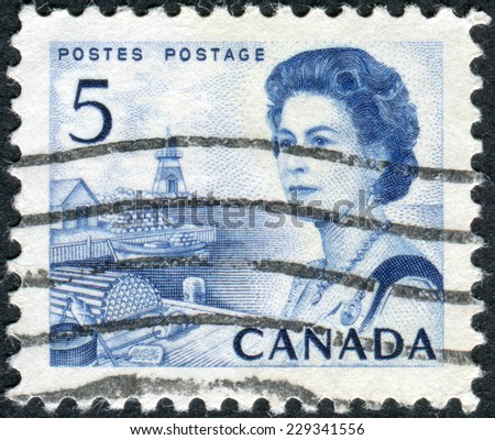 CANADA - CIRCA 1967: Postage stamp printed in Canada, shows a fishing village on the Atlantic coast, a portrait of Queen Elizabeth II, circa 1967