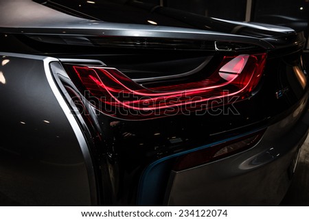 BERLIN - NOVEMBER 28, 2014: Showroom. The rear lights of the car BMW i8, first introduced as the BMW Concept Vision Efficient Dynamics, is a plug-in hybrid sports car developed by BMW. Toning