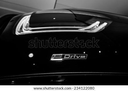 BERLIN - NOVEMBER 28, 2014: Showroom. Stoplight of the BMW i3, previously Mega City Vehicle (MCV), is a five-door urban electric car developed by the German manufacturer BMW. Black and white.