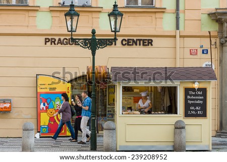 PRAGUE, CZECH REPUBLIC - SEPTEMBER 18, 2014: Preparation and sale trdelnik (Trdlo) - Czech traditional sweet pastries. Prague is the capital and largest city of the Czech Republic.
