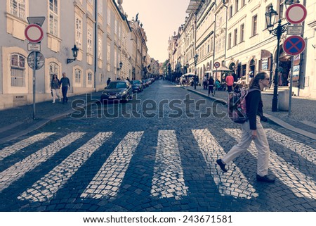 PRAGUE, CZECH REPUBLIC - SEPTEMBER 19, 2014: The streets of the old town. Crosswalk (zebra). District Mala Strana - Lesser Town of Prague. Stylization. Toning