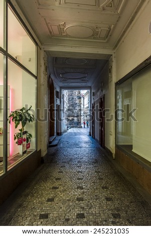PRAGUE, CZECH REPUBLIC - SEPTEMBER 19, 2014: The passage through the house, connecting streets in the old town. Prague is the capital and largest city of the Czech Republic.