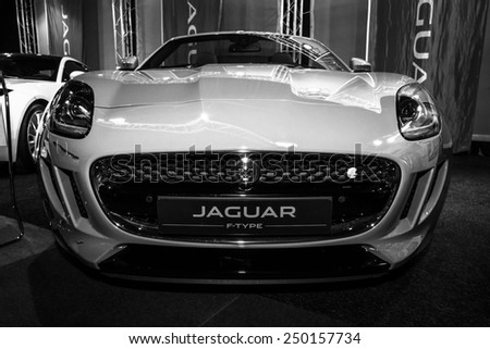 MAASTRICHT, NETHERLANDS - JANUARY 08, 2015: Sports car Jaguar F-Type Roadster. Black and white. International Exhibition InterClassics & Topmobiel 2015