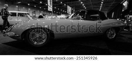 MAASTRICHT, NETHERLANDS - JANUARY 08, 2015: The sports car Jaguar E-Type Series 1. Black and white. International Exhibition InterClassics & Topmobiel 2015