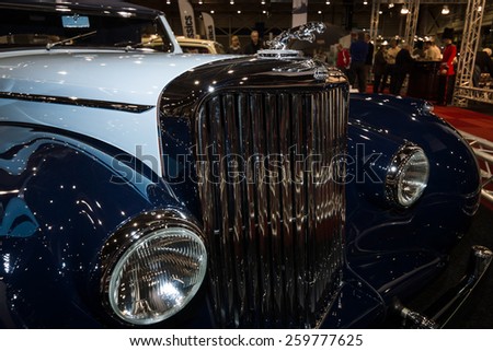 MAASTRICHT, NETHERLANDS - JANUARY 09, 2015: Hood ornament of a British two-door sports saloon Jaguar Mk IV 3,5 litre Drop Head Coupe Vanden Plas, 1947. Int. Exhibition InterClassics & Topmobiel 2015