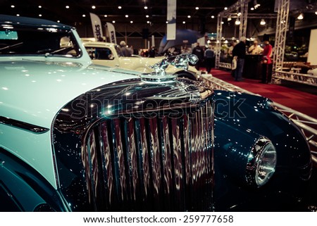 MAASTRICHT, NETHERLANDS - JANUARY 09, 2015: Hood ornament of a 2-door sports saloon Jaguar Mk IV 3,5 litre Drop Head, 1947. Vintage toning. Stylization. Int. Exhibition InterClassics & Topmobiel 2015