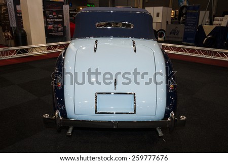 MAASTRICHT, NETHERLANDS - JANUARY 09, 2015: British two-door sports saloon Jaguar Mk IV 3,5 litre Drop Head Coupe Vanden Plas, 1947. Rear view. International Exhibition InterClassics & Topmobiel 2015