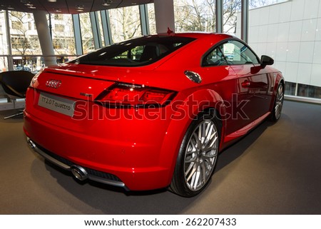 BERLIN - MARCH 08, 2015: Showroom. Sports car Audi TT 2.0 T quattro (2014). Audi AG  is a German automobile manufacturer.