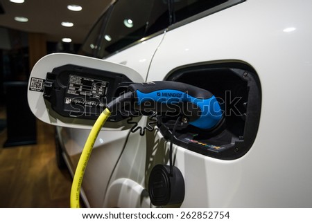 BERLIN - JANUARY 24, 2015: Showroom. The process of charging the battery a compact luxury car Mercedes-Benz B-Class Electric Drive. The first production car with an electric engine. Since 2014.