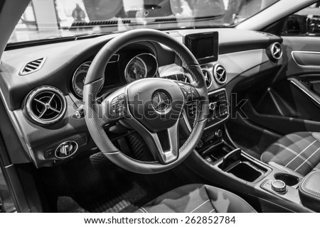 BERLIN - JANUARY 24, 2015: Showroom. Cabin of a compact luxury car Mercedes-Benz B-Class Electric Drive. Black and white. The first production car with an electric engine. Produced since 2014.