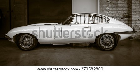 BERLIN - MAY 10, 2015: British sports car Jaguar E-Type (Jaguar XK-E). Vintage toning. Sepia. 28th Berlin-Brandenburg Oldtimer Day